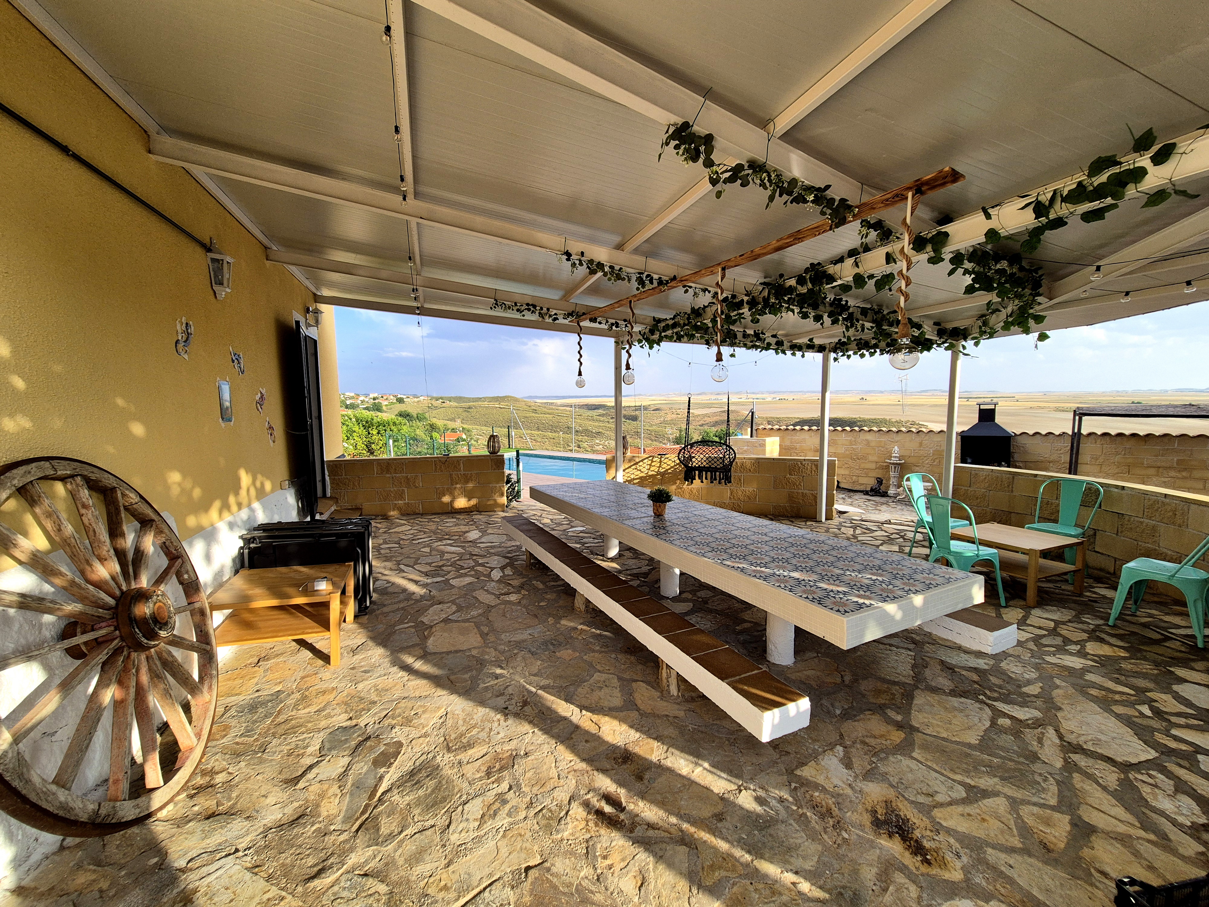 Patio Covering with a Rest Area and a Swimming Pool